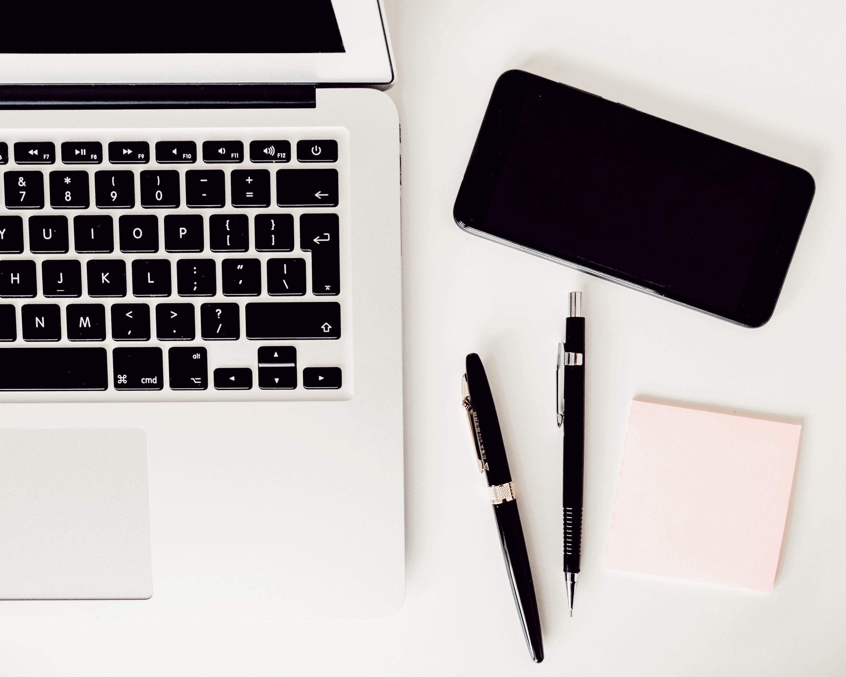 Laptop, Phone And Pens