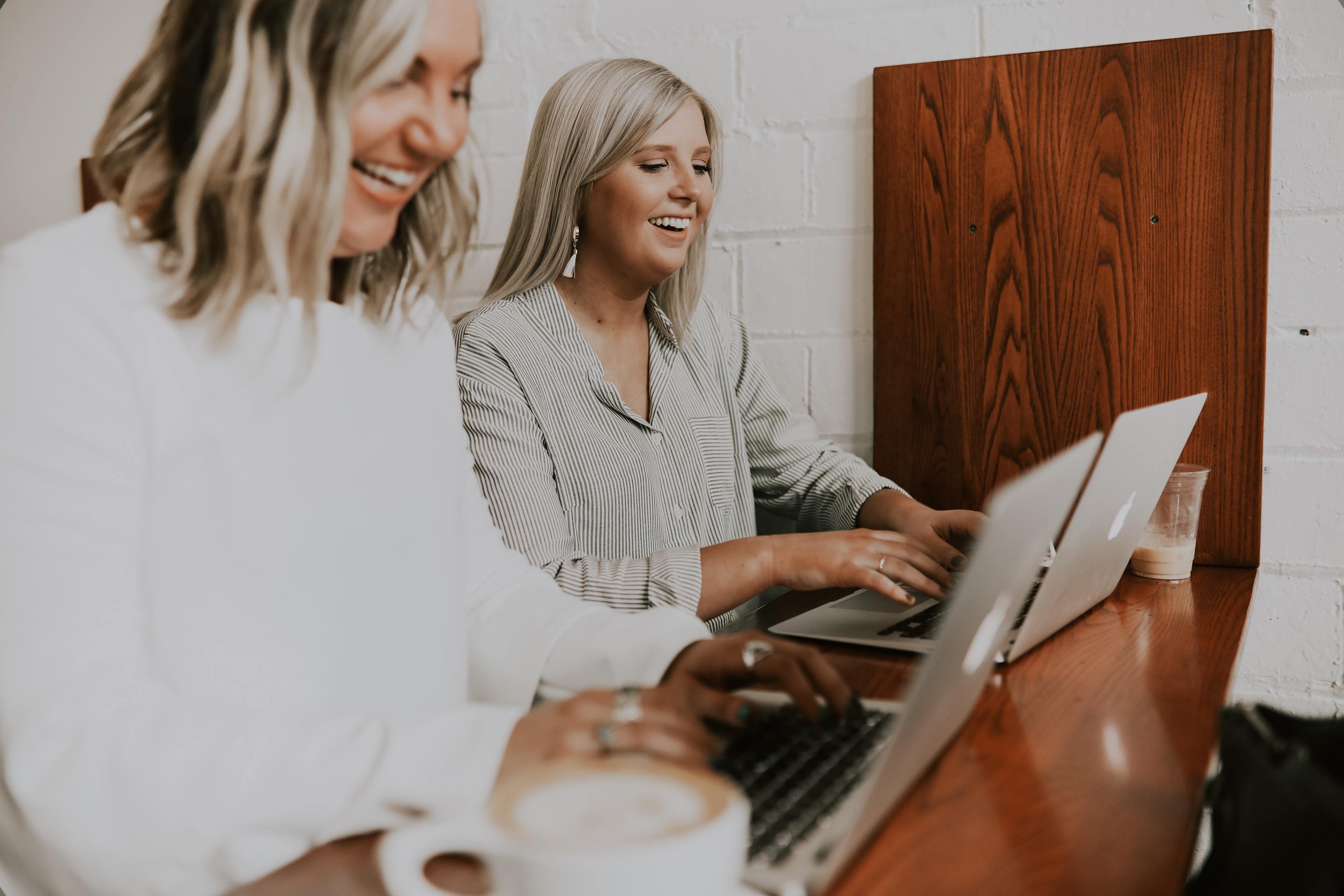 Women At Desk With Laptops Prospecting