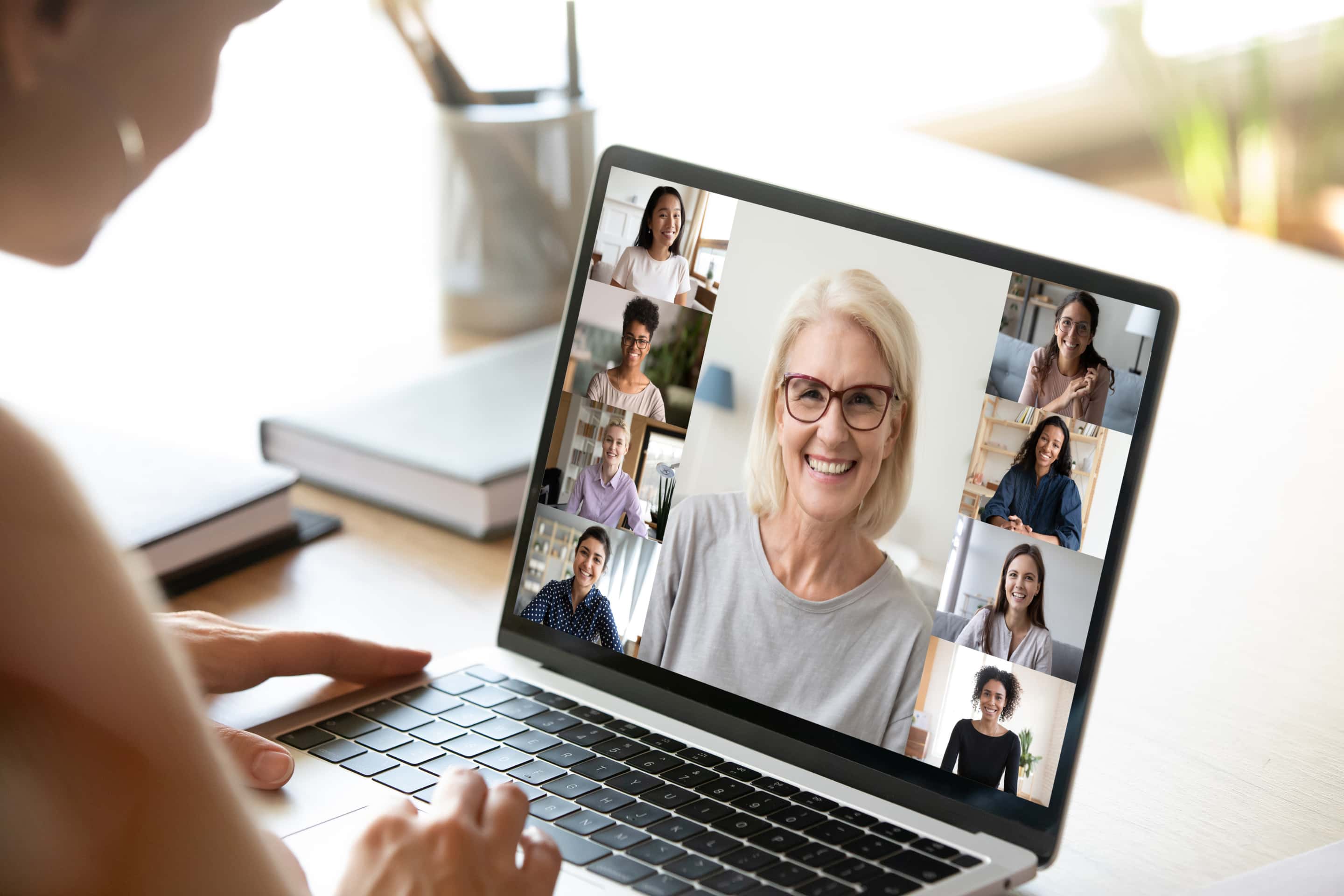 Diverse Woman Involved In Group Videocall, Laptop Screen View